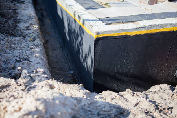 Professional Waterproofing technician working in Auburn University, AL